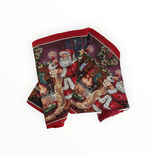CE Collection Christmas table runner featuring a festive Santa Claus tapestry design with red tassel accents