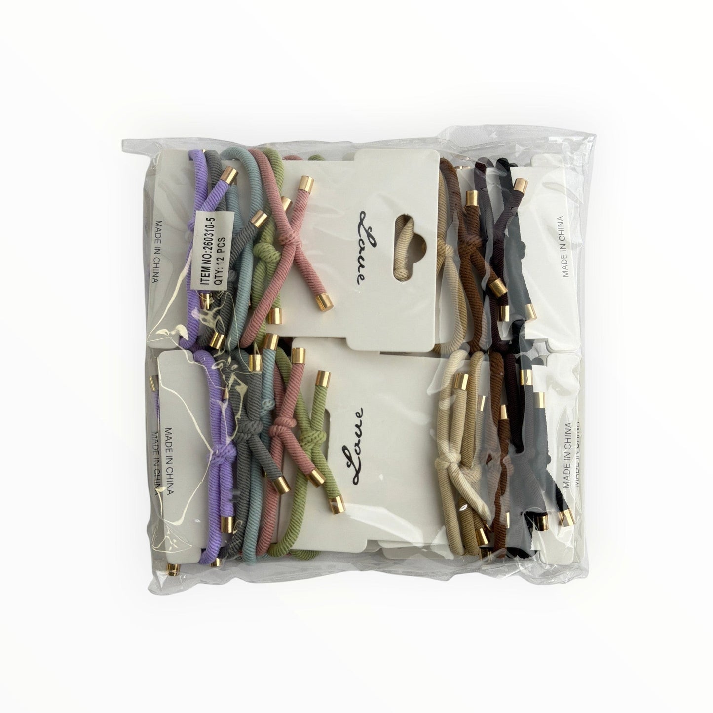 CE Collection hair elastics in pastel and neutral tones with gold accents, 12 cards per pack.